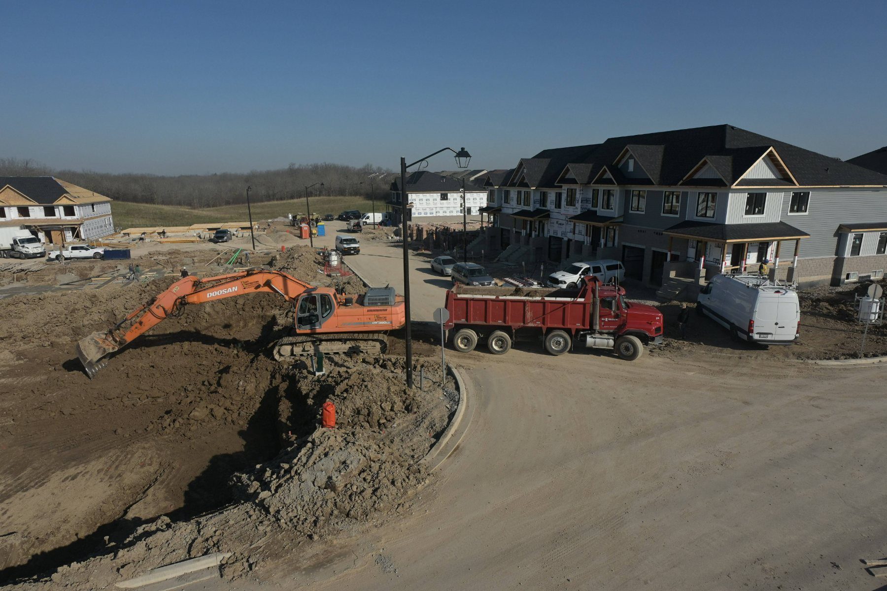 Excavator working on Riverview foundations.