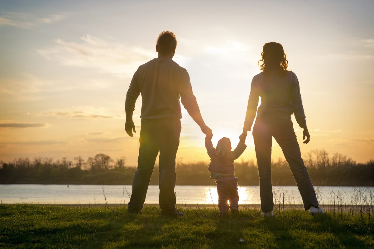 Family at sunset by the water